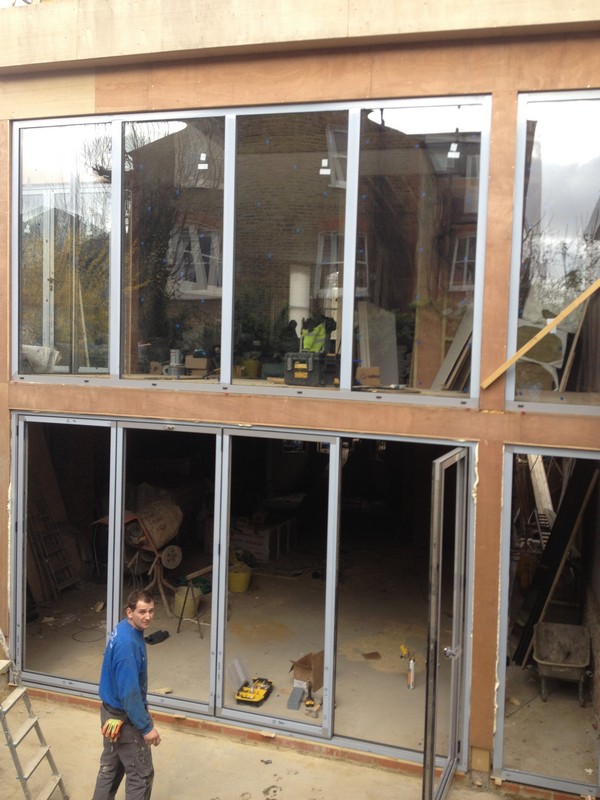 Aluminium bi-fold doors with two-storey glazing in Woolwich