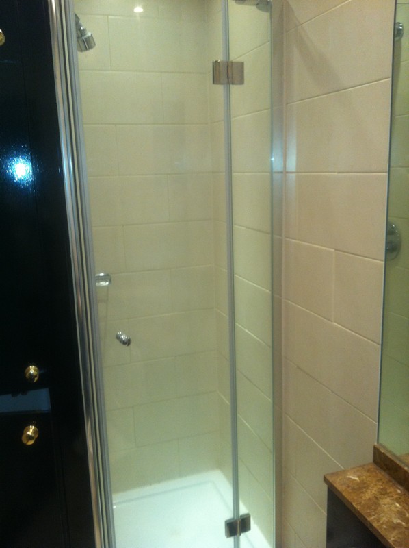 Frameless glass shower enclosure with chrome fittings in Woolwich