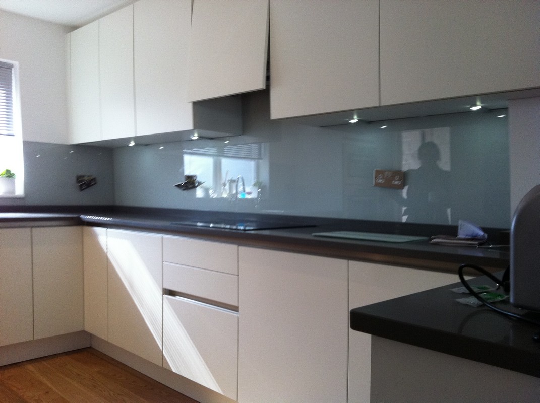 Grey glass kitchen splashback with LED lighting in Woolwich
