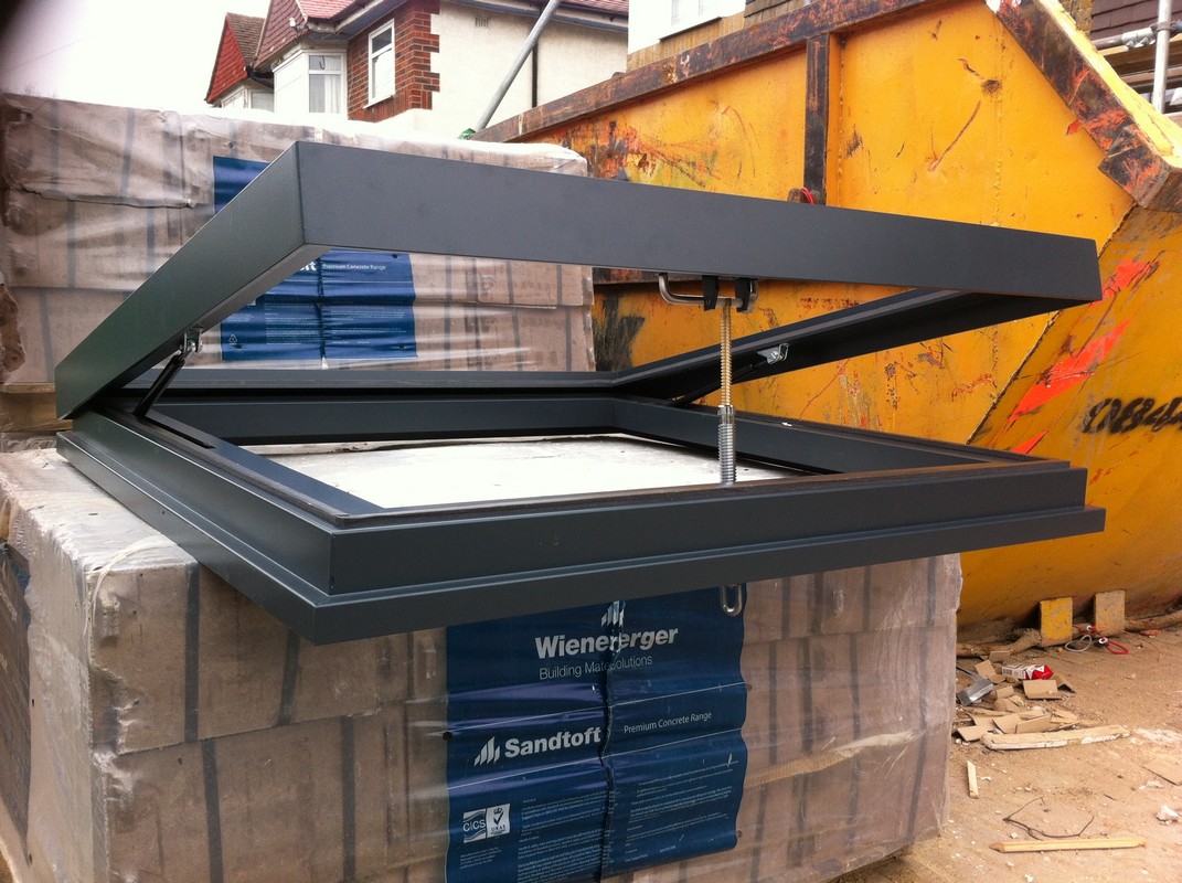 Opening flat roof skylight in anthracite grey installed in Woolwich