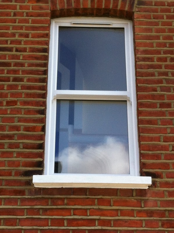 uPVC sash window on Victorian red brick house in Woolwich